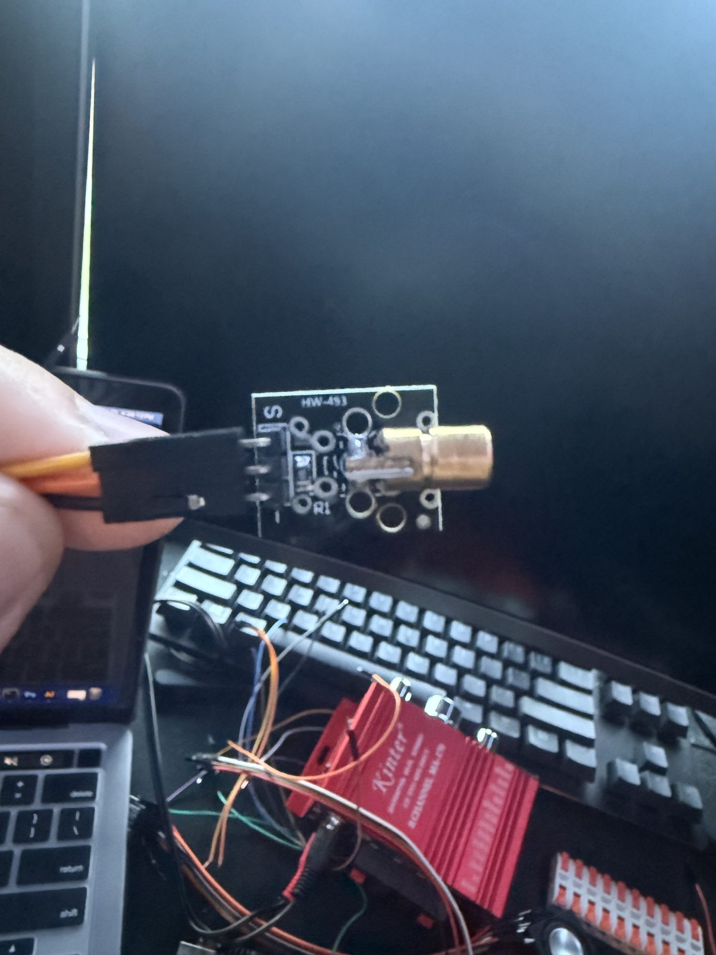 Handheld laser transmitter module with the beam visible